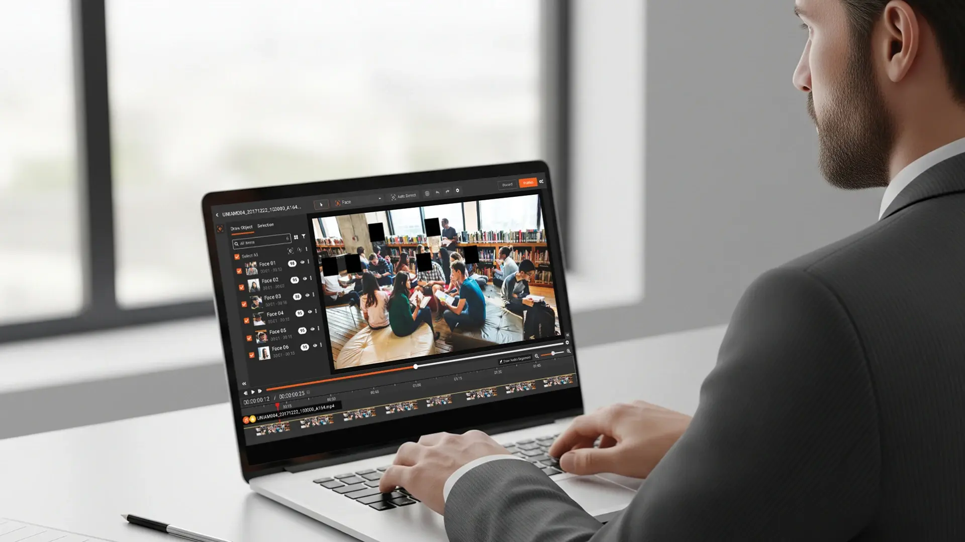 a person redacting faces of children in school