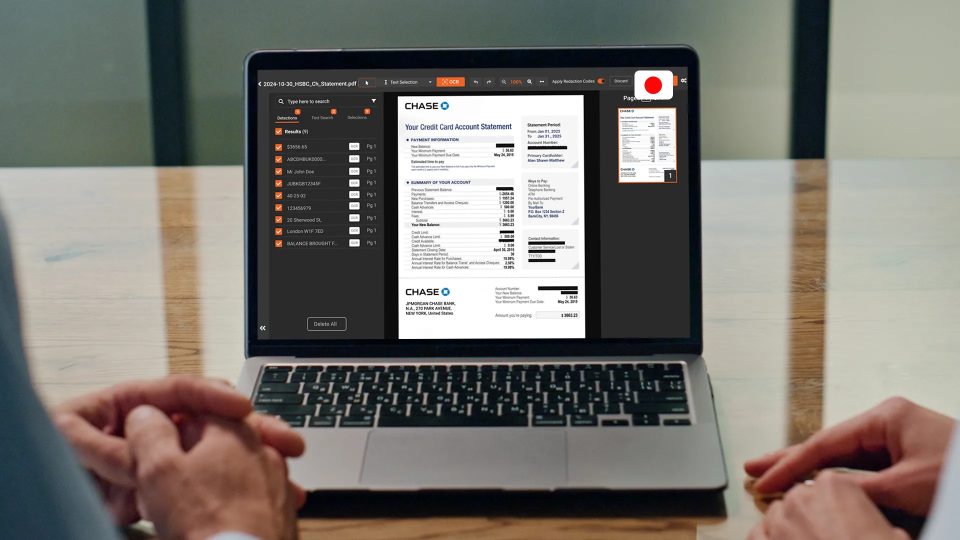 a person redacting financial documents