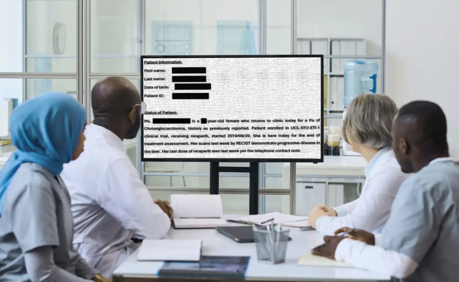 a team of medical professionals looking at the redacted PHI