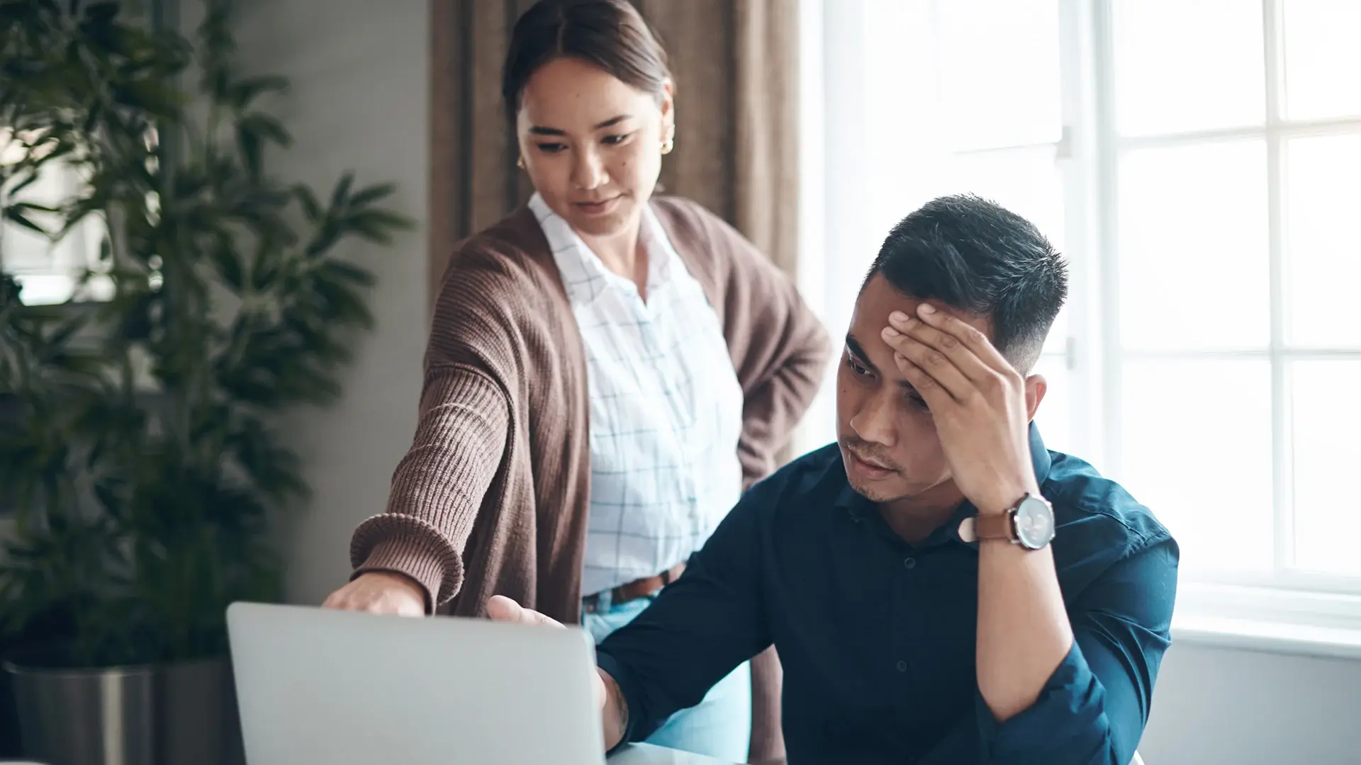 give short img alt text4:12 PMClaude responded: Two people reviewing insurance claim data on a laptop, one looking concerned.Two people reviewing insurance claim data on a laptop, one looking concerned.