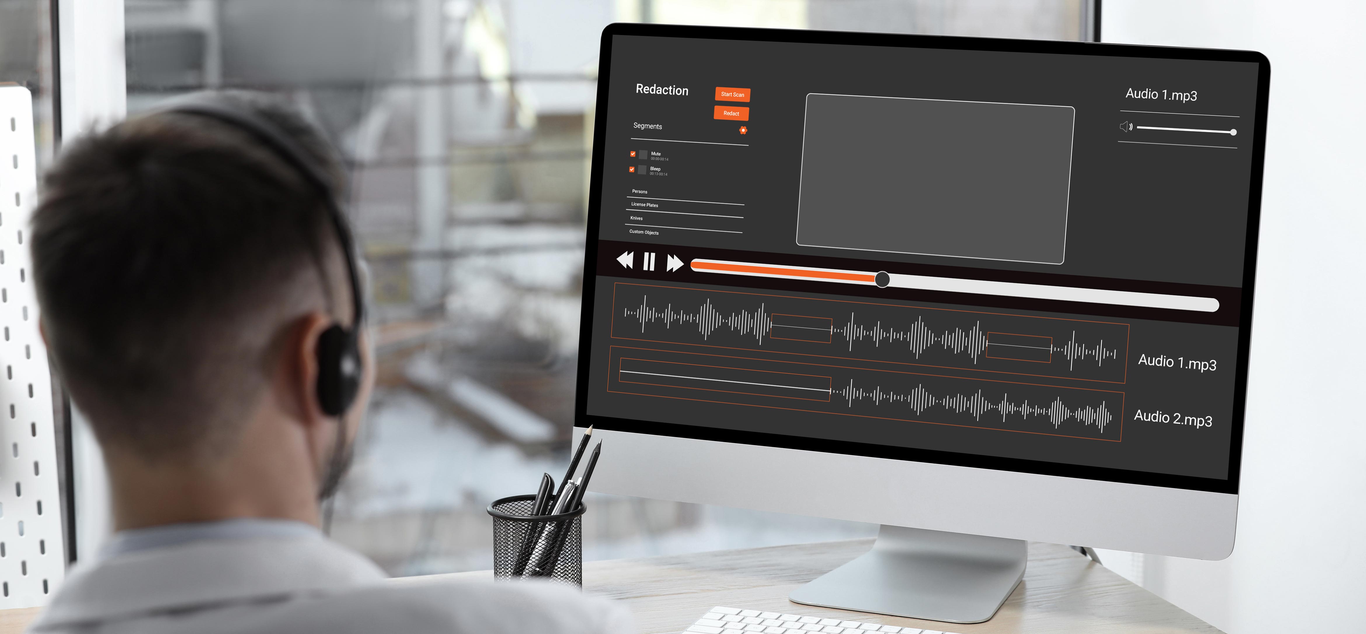 A reviewer with headphones looking at two audio tracks of a call recording