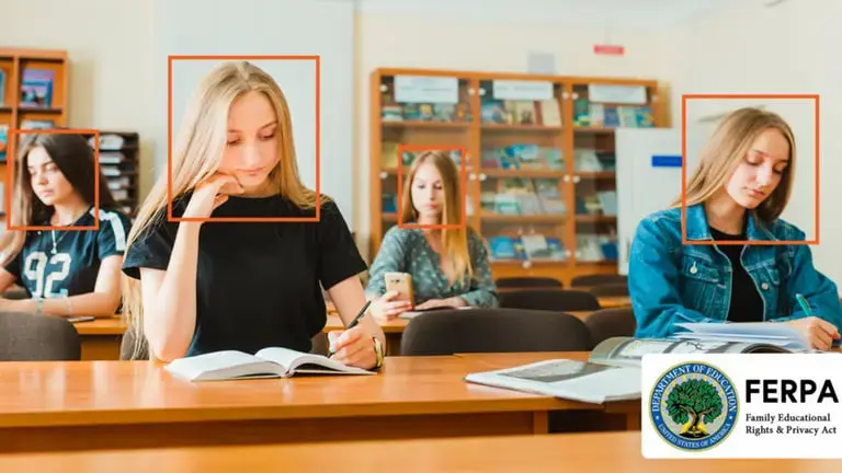 4 female students sitting in a classroom with education redaction software redacting two student's faces.