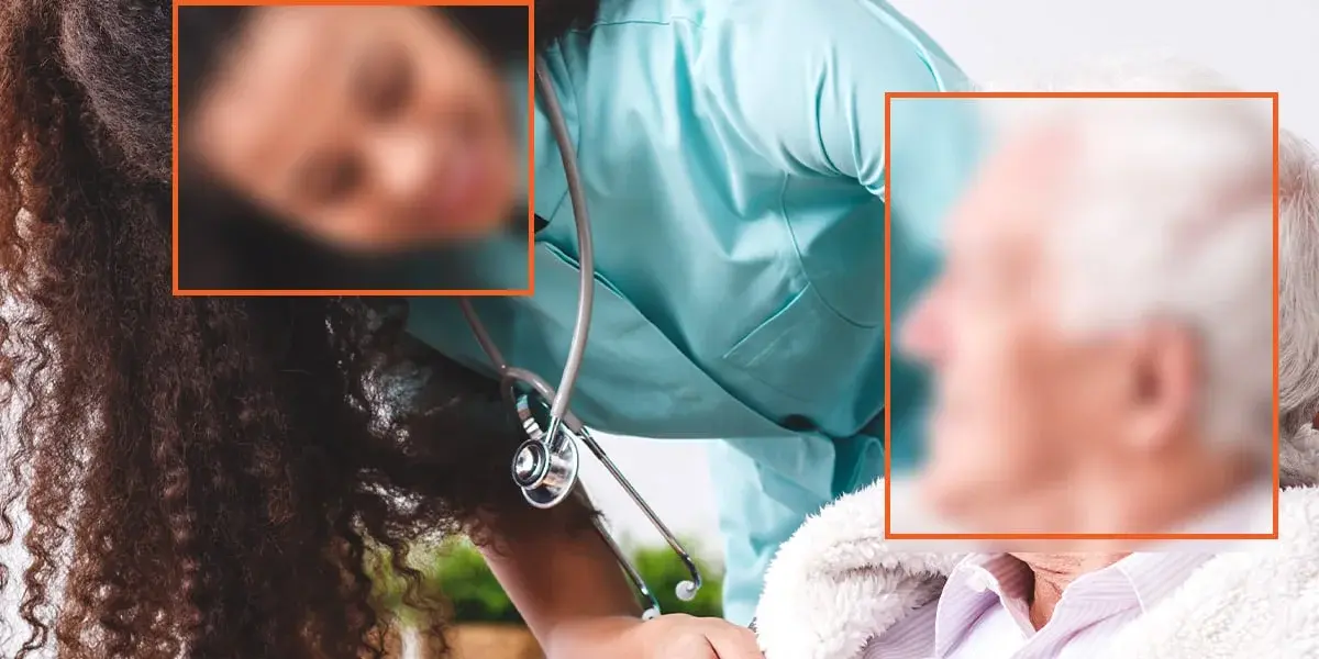 A clinical photo with two faces marked by redaction boxes